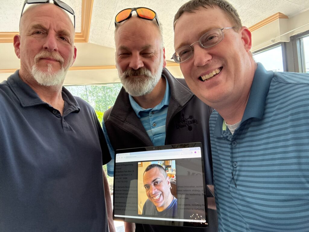 Photo of Tim Egan, Owen Provencher, and Jim Palmer with image of Bernardo Moronta.